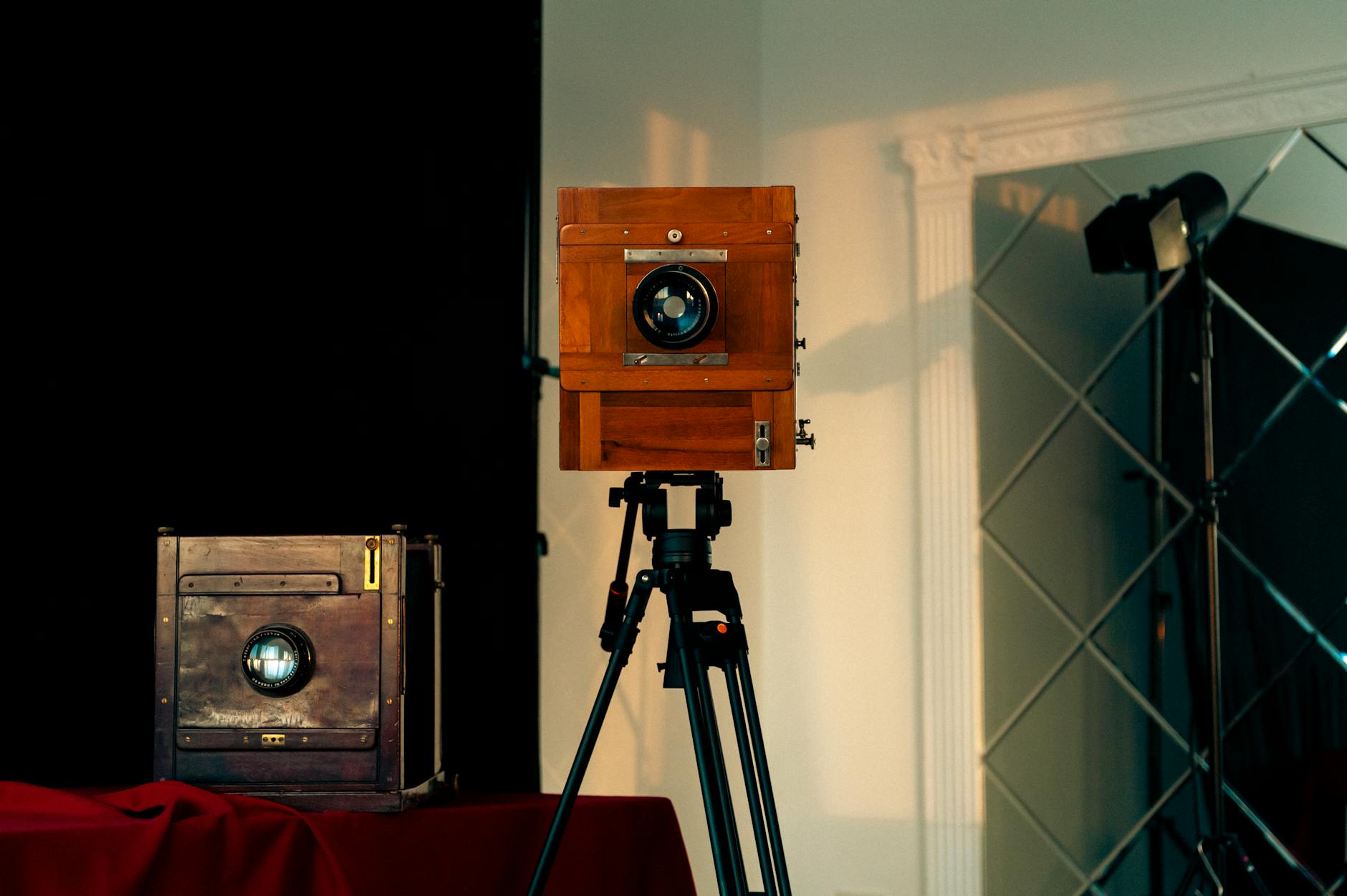 vintage wooden camera on tripod in studio