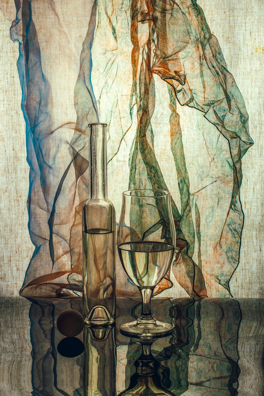 elegant wine still life with abstract fabric